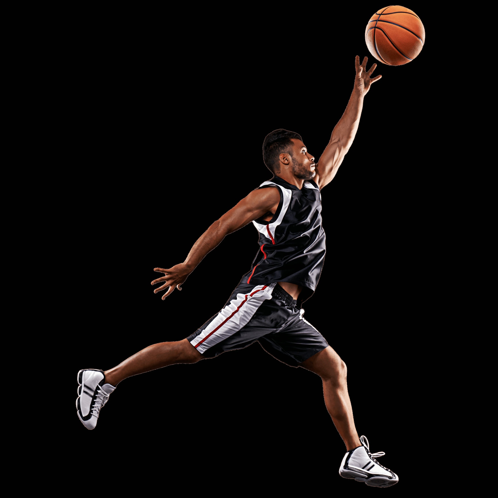 Basketball player rising for the ball